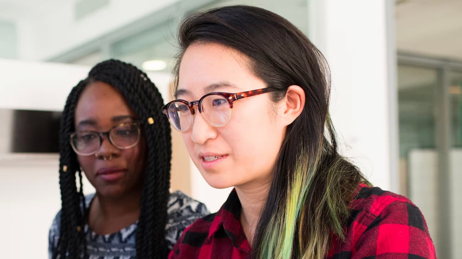 Baby Yoda at work with a colleague